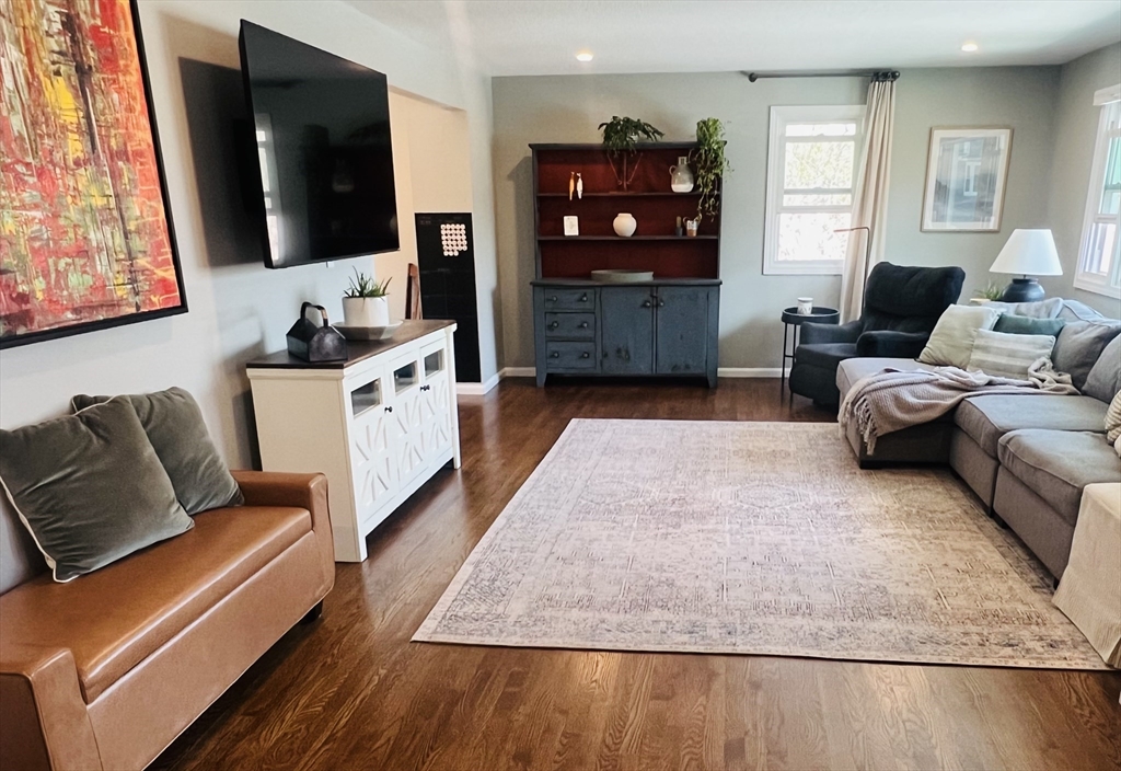 35 Pearl Street, Unit 35 Randolph, MA 02368 - Photo 17 of 31 a living room with furniture and a flat screen tv