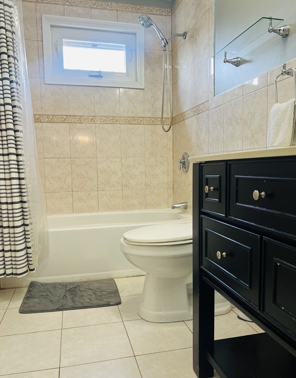 35 Pearl Street, Unit 35 Randolph, MA 02368 - Photo 19 of 31 a bathroom with a sink a toilet and shower