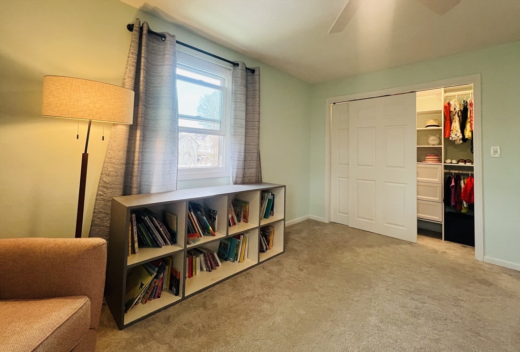 35 Pearl Street, Unit 35 Randolph, MA 02368 - Photo 25 of 31 a living room with furniture and a window