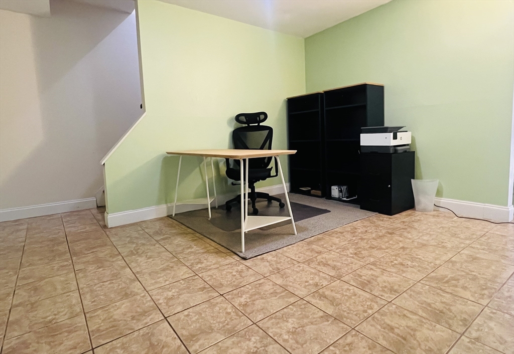 35 Pearl Street, Unit 35 Randolph, MA 02368 - Photo 30 of 31 a bedroom with a bed and cabinets