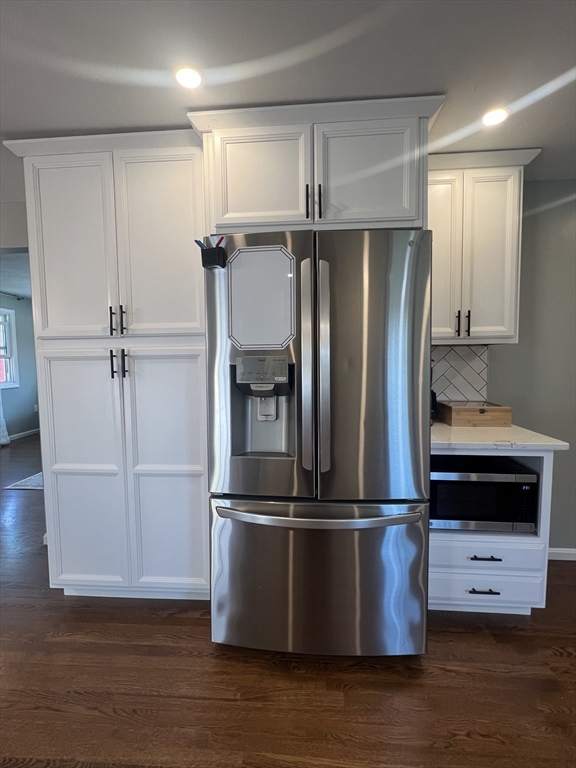 35 Pearl Street, Unit 35 Randolph, MA 02368 - Photo 5 of 31 a kitchen with a refrigerator and cabinets