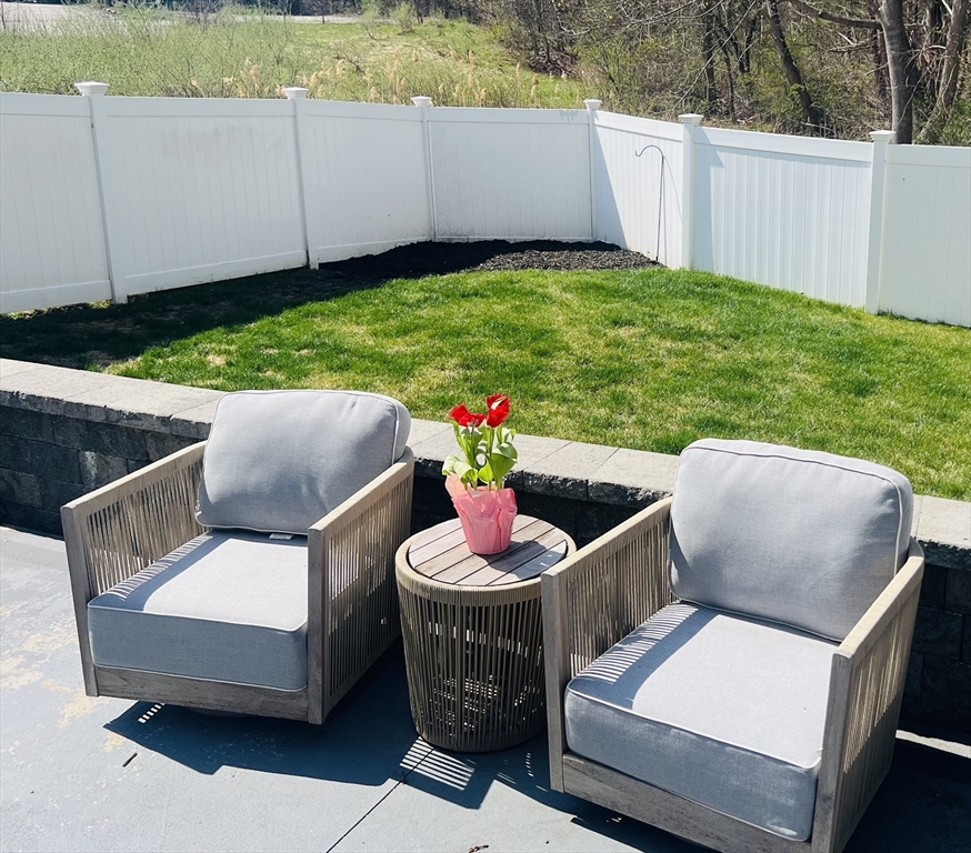 35 Pearl Street, Unit 35 Randolph, MA 02368 - Photo 6 of 31 a view of outdoor sitting area with furniture and garden