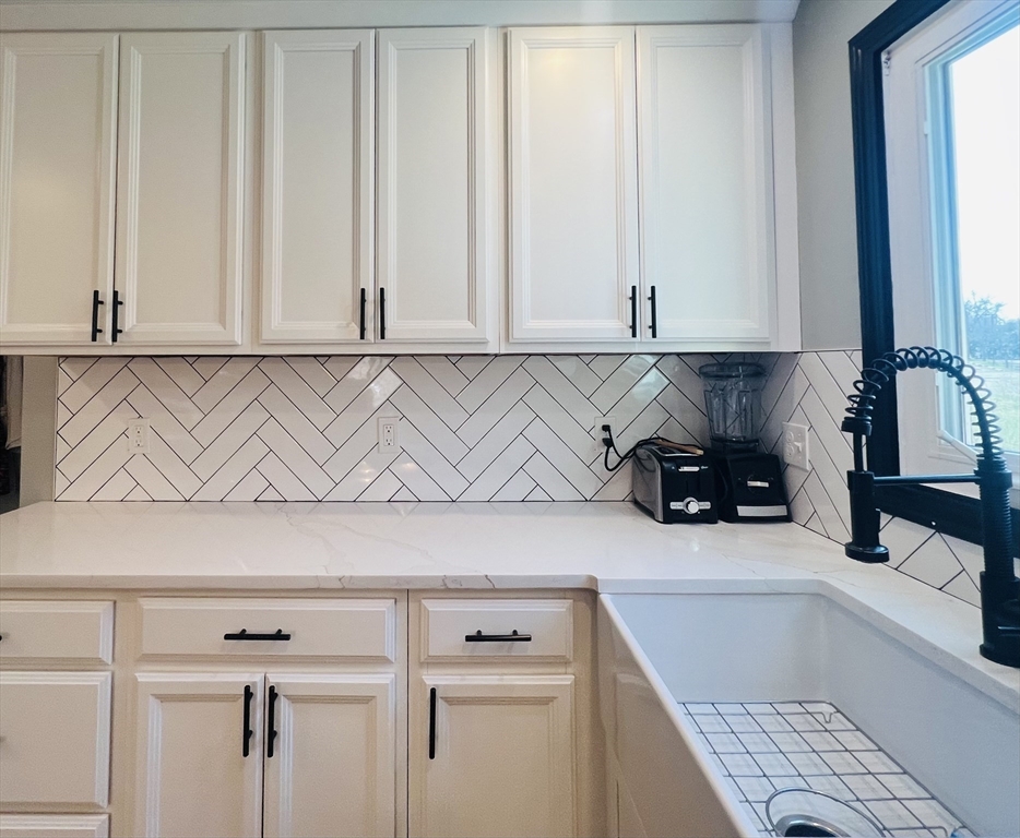 35 Pearl Street, Unit 35 Randolph, MA 02368 - Photo 9 of 31 a view of kitchen with furniture and cabinets