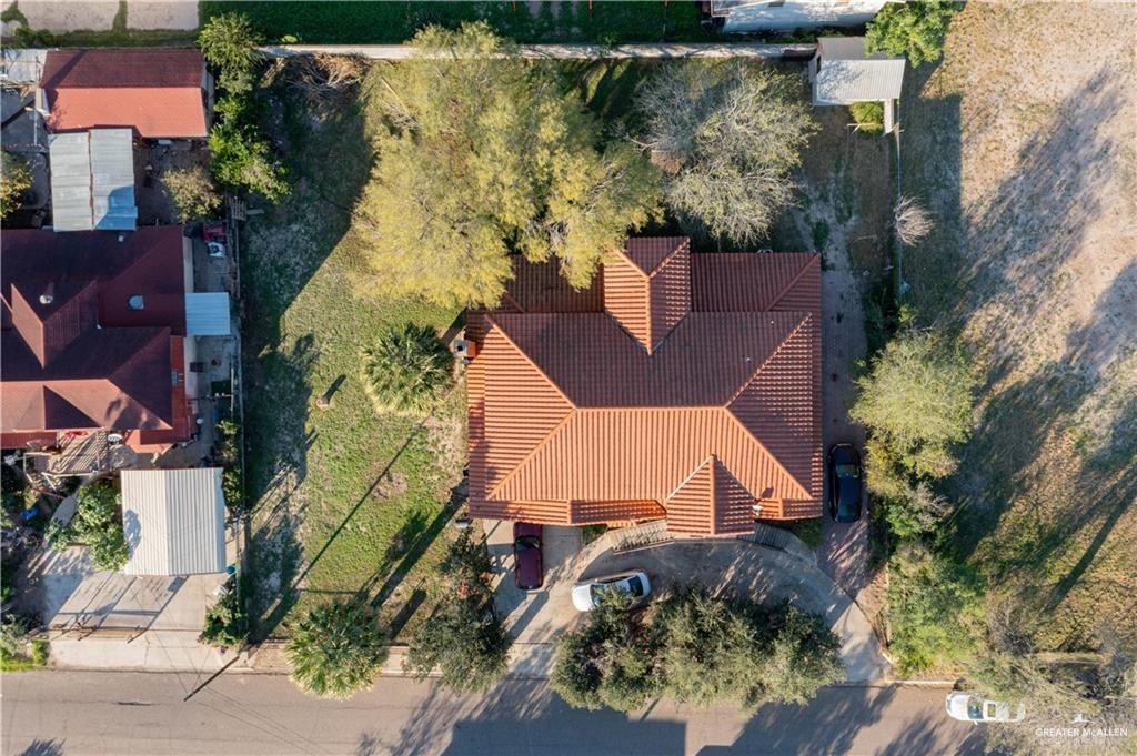 933 East 4th Street Roma, TX 78584 - Photo 12 of 15 an aerial view of a house with a yard and garden