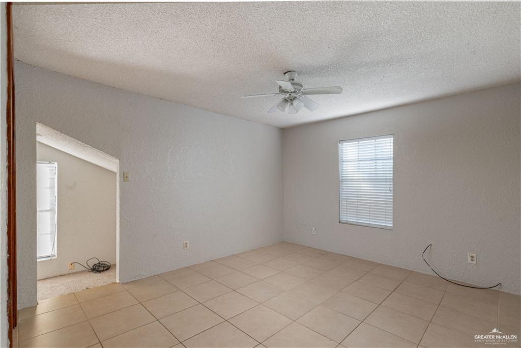 933 East 4th Street Roma, TX 78584 - Photo 3 of 15 a view of an empty room with a window