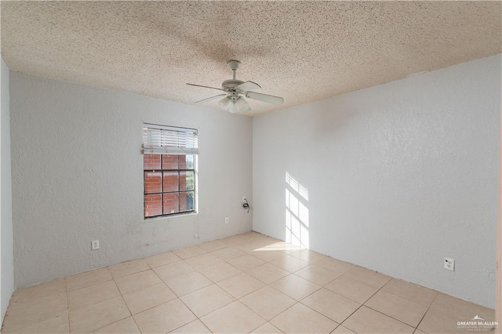 933 East 4th Street Roma, TX 78584 - Photo 8 of 15 a view of an empty room with a window
