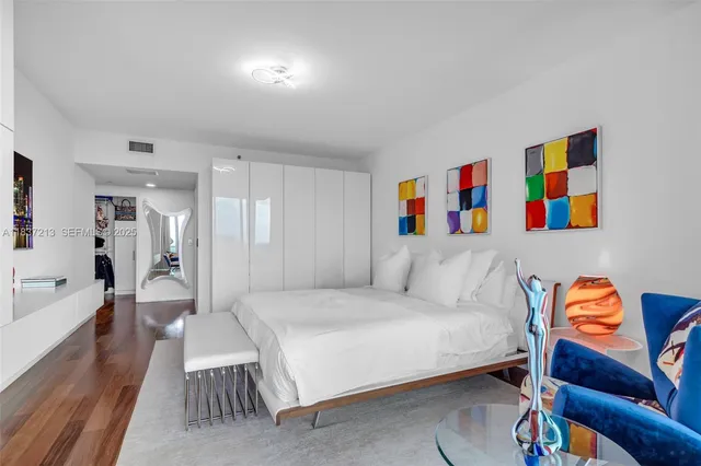 a view of a dining room with furniture and a kitchen