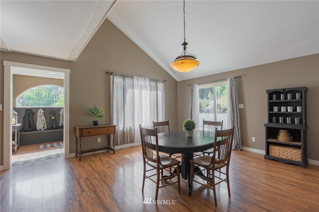 5202 Reese Hill Road Sumas, WA 98295 - Photo 5 of 39 a view of a dining room with furniture and wooden floor