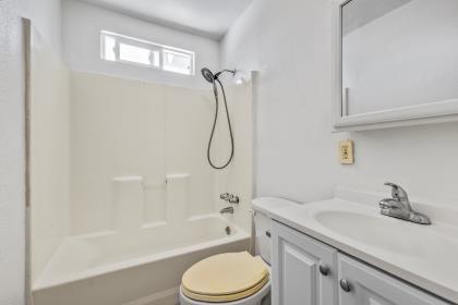 1699 Highland Street Seaside, CA 93955 - Photo 12 of 24 a bathroom with a sink toilet vanity and shower