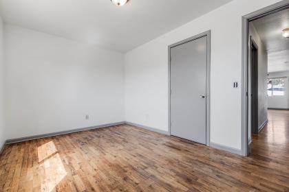 1699 Highland Street Seaside, CA 93955 - Photo 16 of 24 a view of an empty room with wooden floor and a window