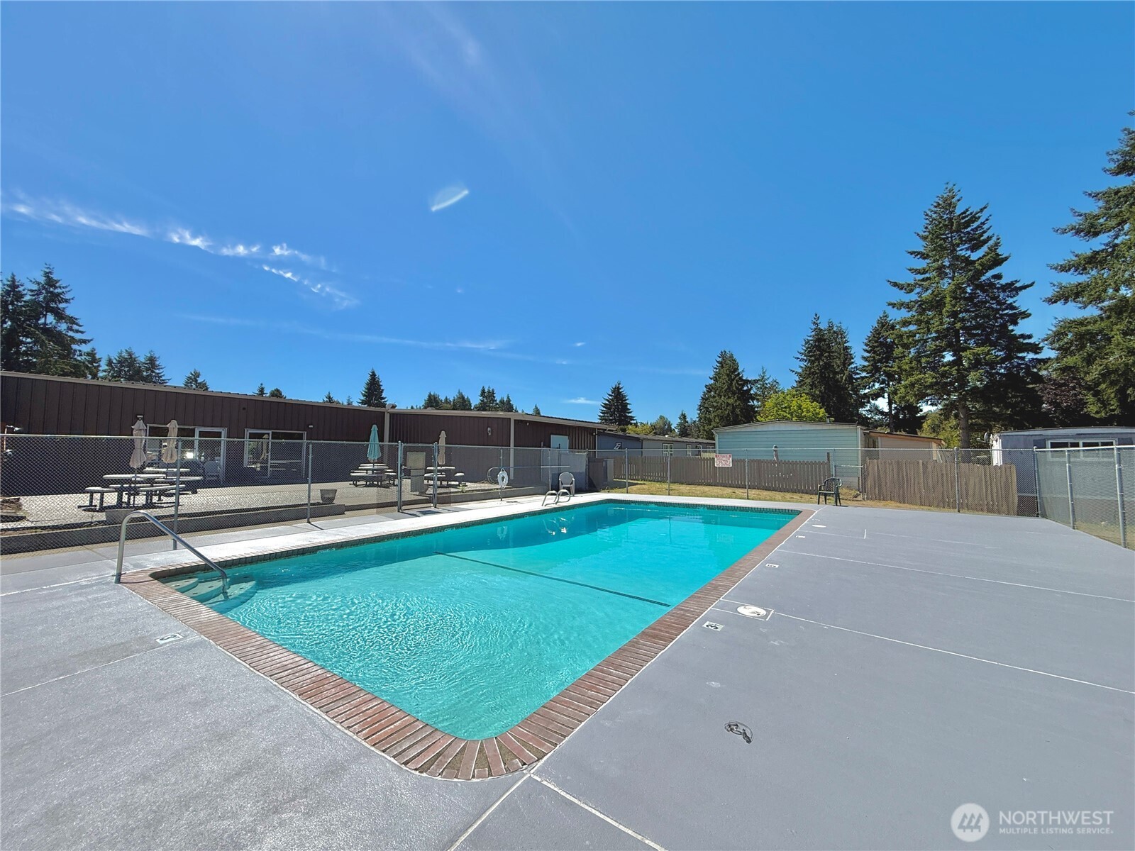 3001 South 288th Street, Unit 343 Federal Way, WA 98003 - Photo 29 of 37 a view of a swimming pool and lounge chairs