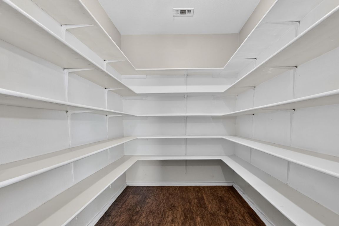 13205 Vizquel Loop Del Valle, TX 78617 - Photo 31 of 31 a view of walk in closet with empty racks