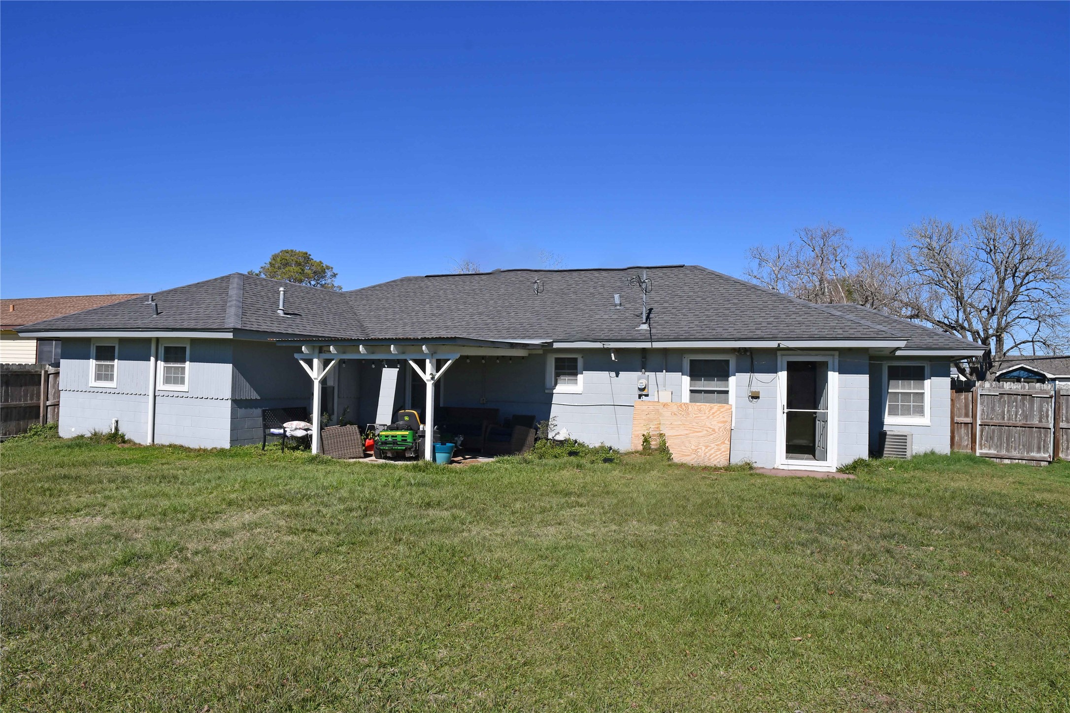 407 Rorem Avenue Palacios, TX 77465 - Photo 17 of 18 a view of a big house with a big yard and large trees