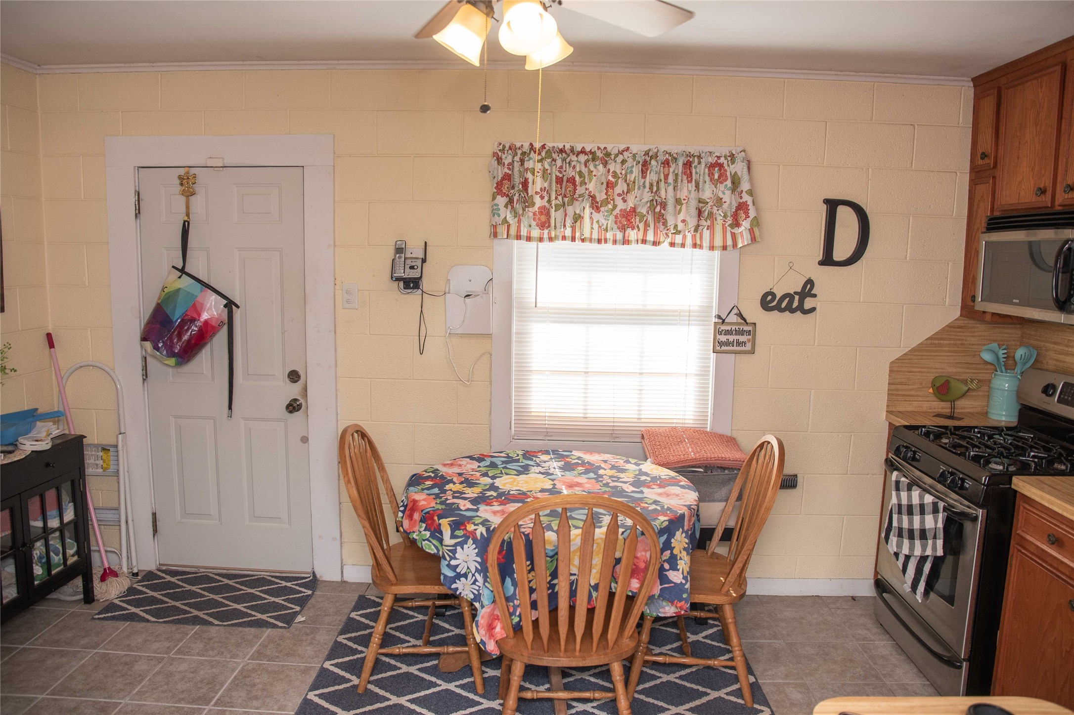 407 Rorem Avenue Palacios, TX 77465 - Photo 6 of 18 a view of a dining room with furniture and chandelier