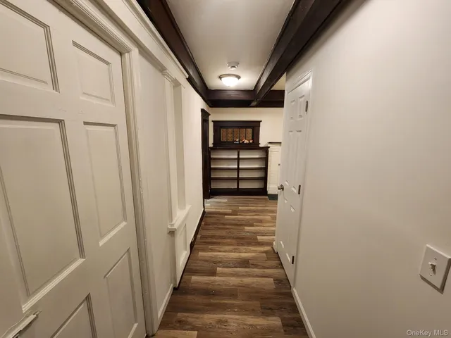 a view of a hallway with stairs