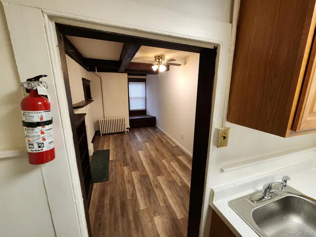 a hallway with storage and utility