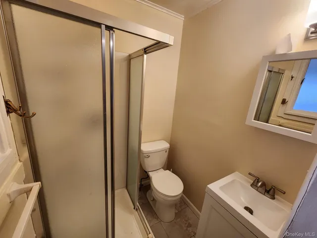 a bathroom with a toilet and a sink