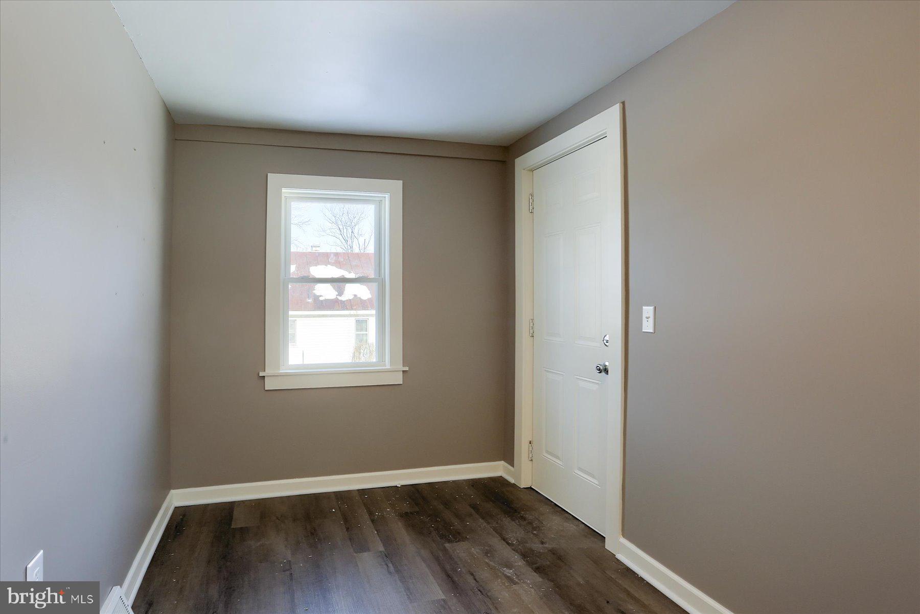 801 North Mountain Road Harrisburg, PA 17112 - Photo 11 of 32 an empty room with wooden floor and windows