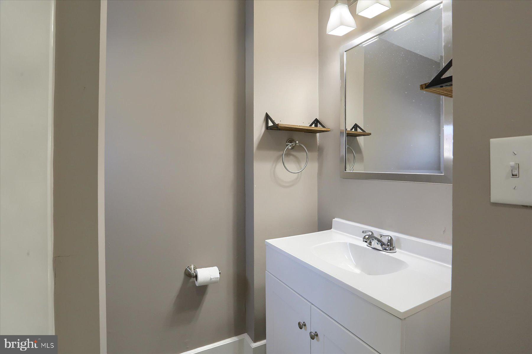 801 North Mountain Road Harrisburg, PA 17112 - Photo 23 of 32 a bathroom with a sink toilet and mirror