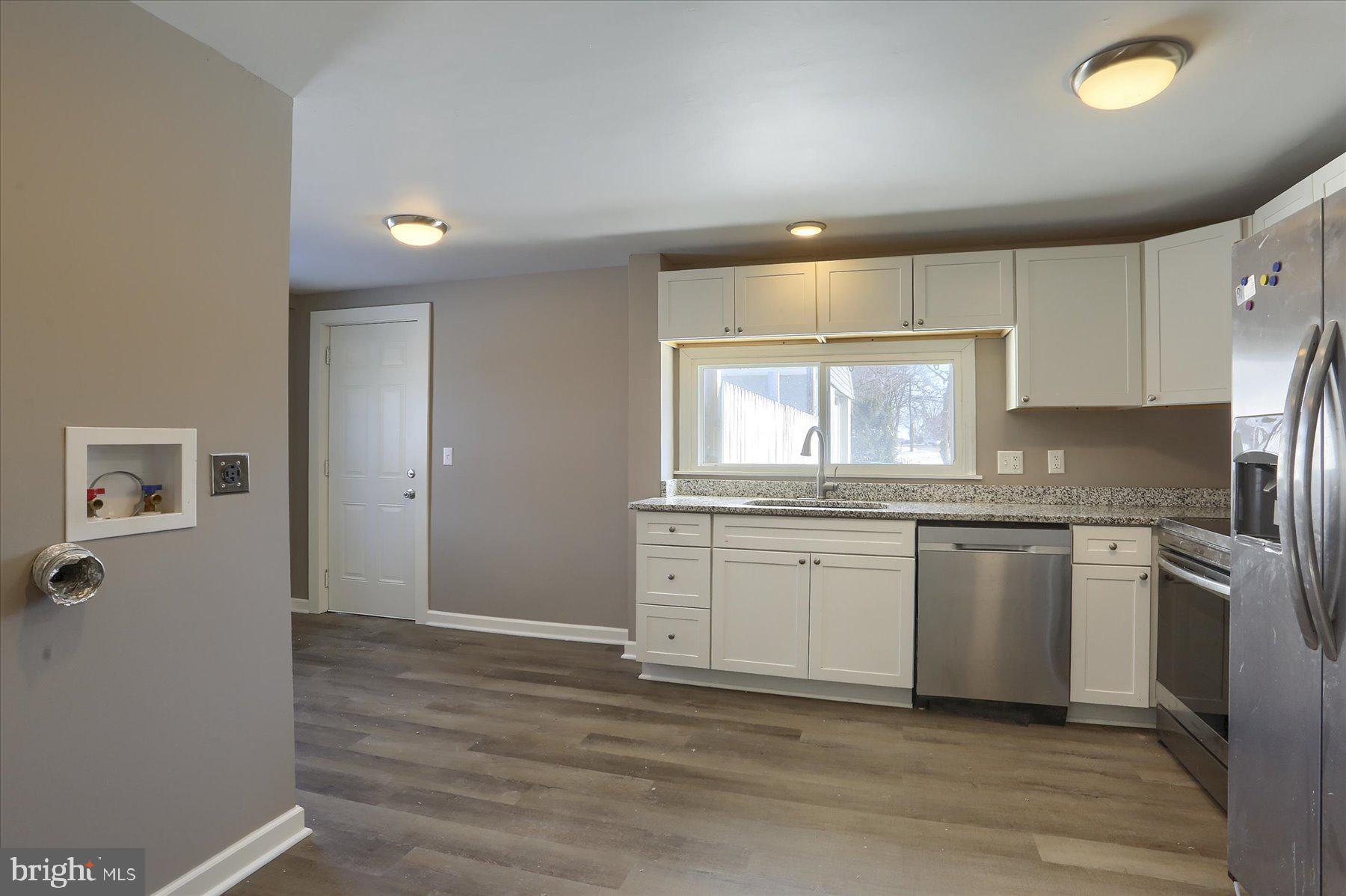 801 North Mountain Road Harrisburg, PA 17112 - Photo 9 of 32 a kitchen with granite countertop cabinets stainless steel appliances a sink and a window