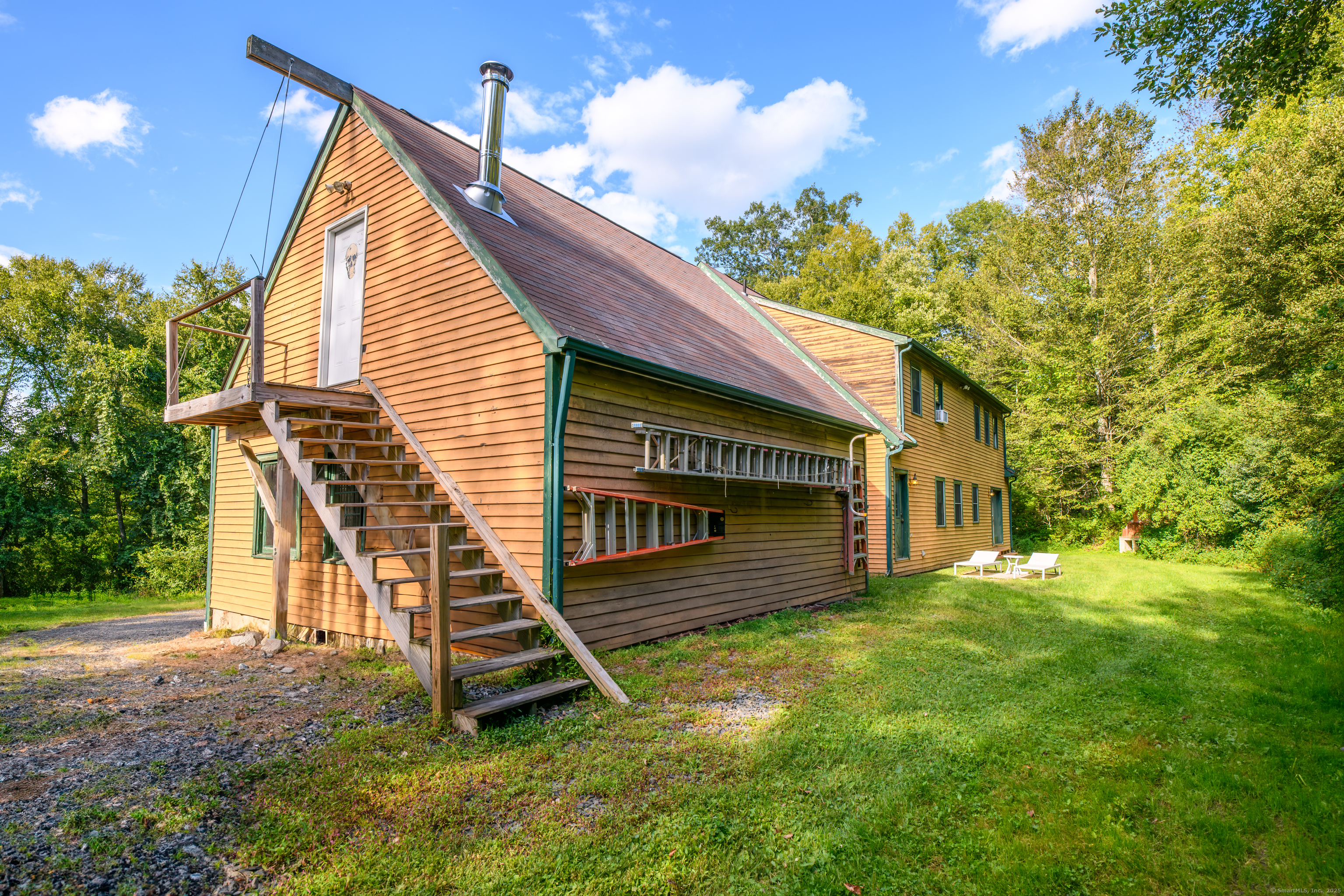 55 Mallory Road Roxbury, CT 06783 - Photo 11 of 34 a view of a house with a backyard