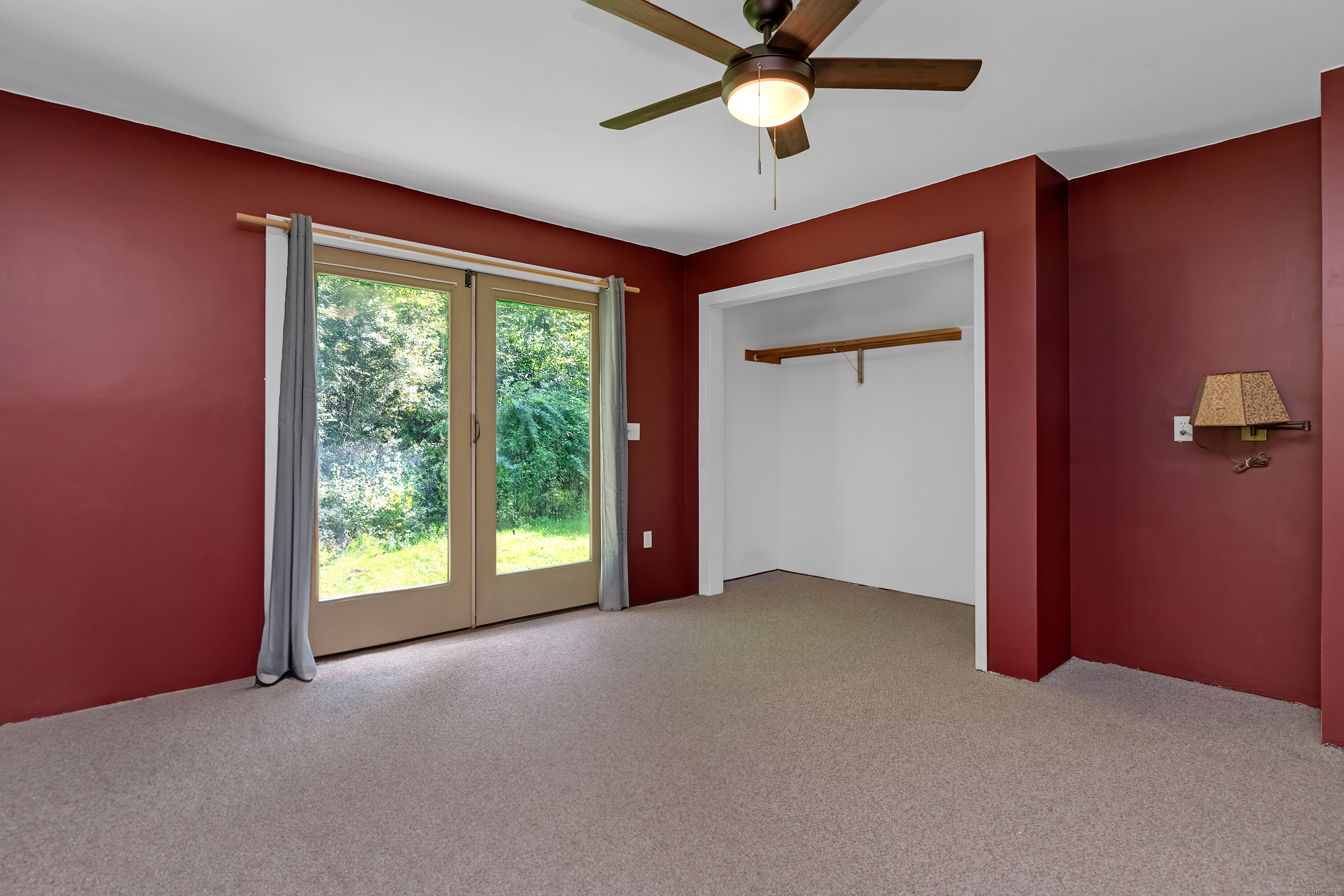 55 Mallory Road Roxbury, CT 06783 - Photo 14 of 34 an empty room with windows and fan