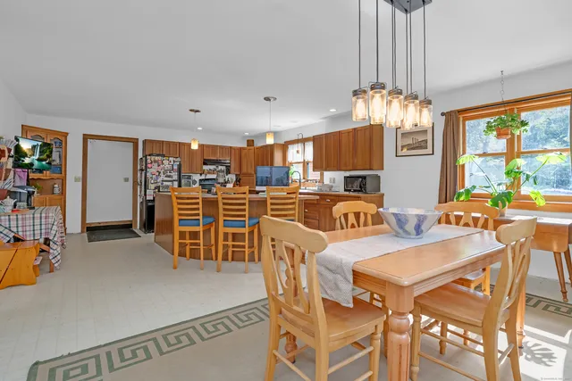 a view of a dining room with furniture window and chandelier