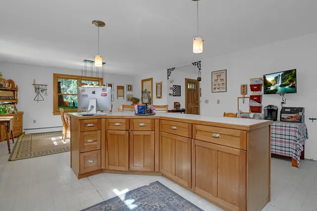 a kitchen with stainless steel appliances granite countertop a sink and a wooden cabinets