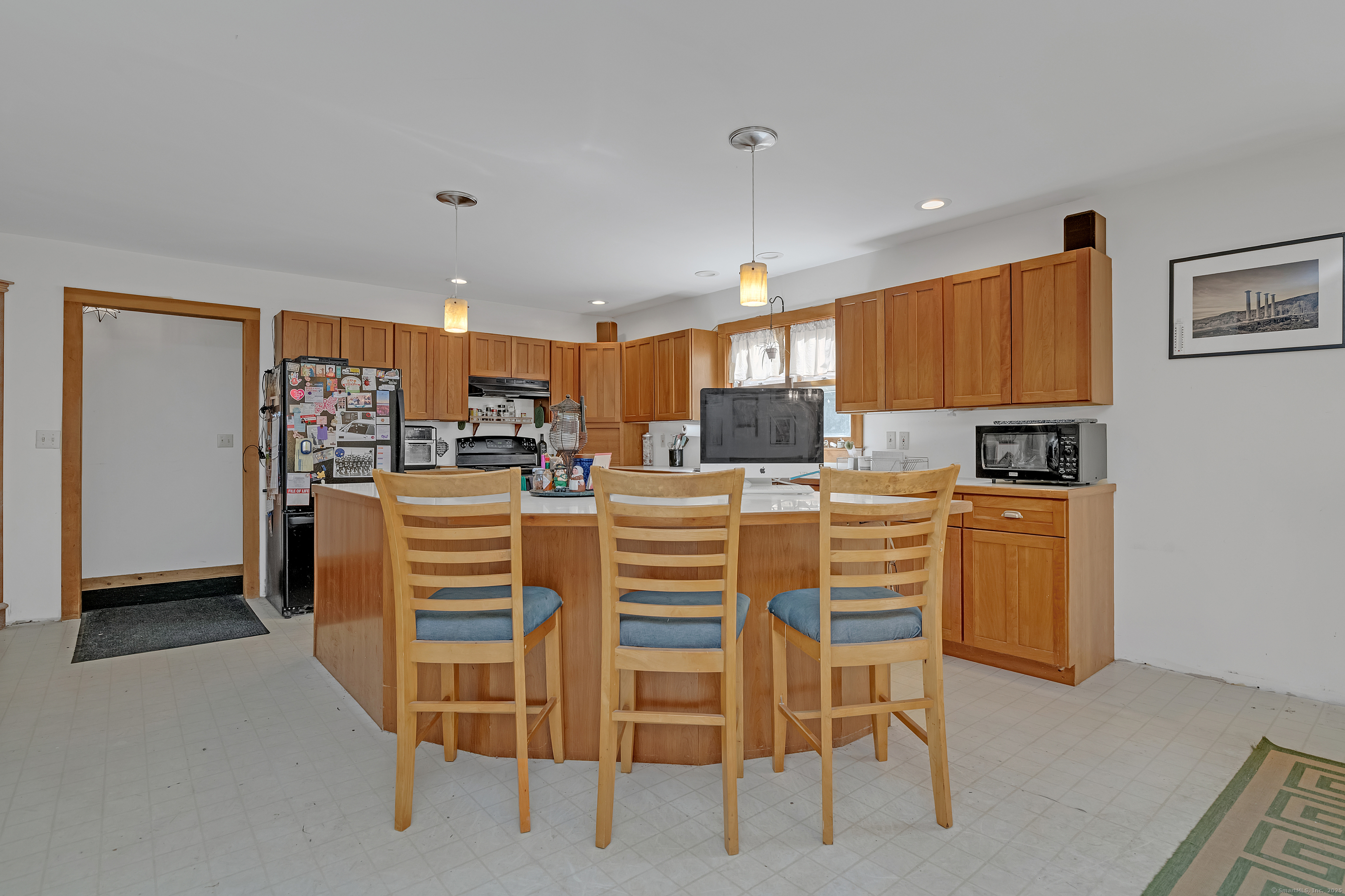 55 Mallory Road Roxbury, CT 06783 - Photo 22 of 34 a kitchen with stainless steel appliances kitchen island granite countertop a refrigerator and a stove top oven