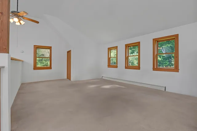 a view of an empty room with windows