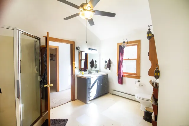 a view of a kitchen with a sink and a refrigerator