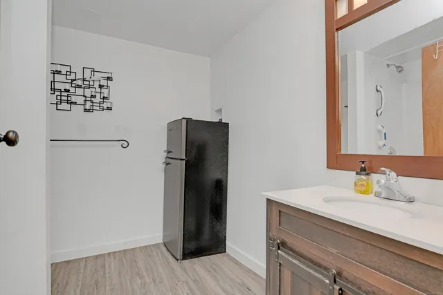a bathroom with a sink and a mirror