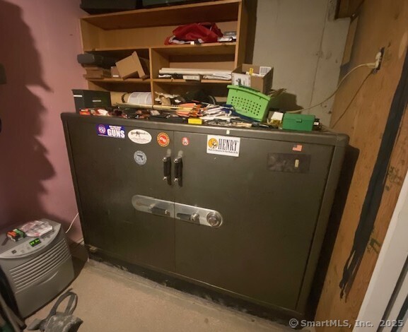 55 Mallory Road Roxbury, CT 06783 - Photo 34 of 34 a room with water heater and wooden cabinets