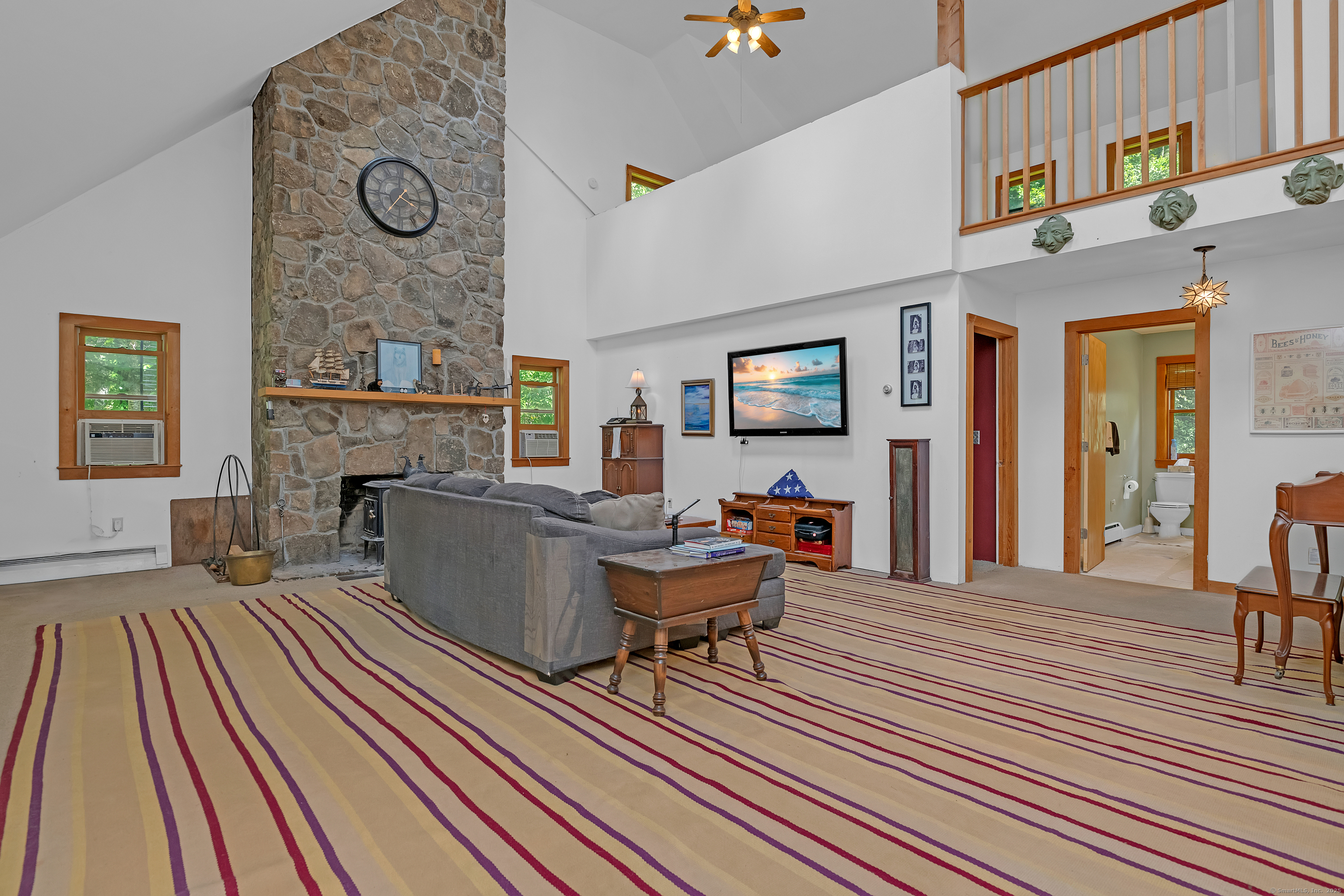 55 Mallory Road Roxbury, CT 06783 - Photo 5 of 34 a living room with furniture and a fireplace