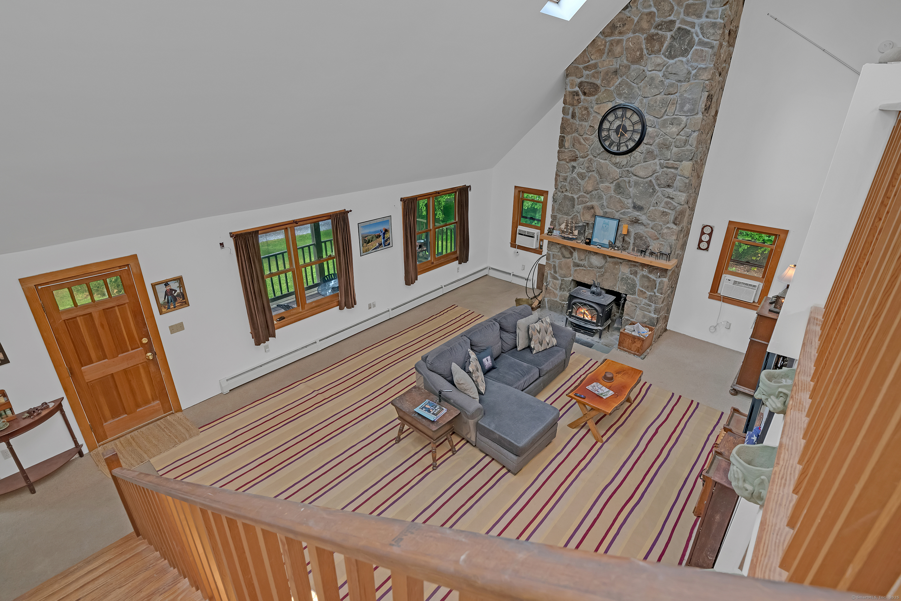 55 Mallory Road Roxbury, CT 06783 - Photo 7 of 34 a view of a livingroom with furniture and wooden floor