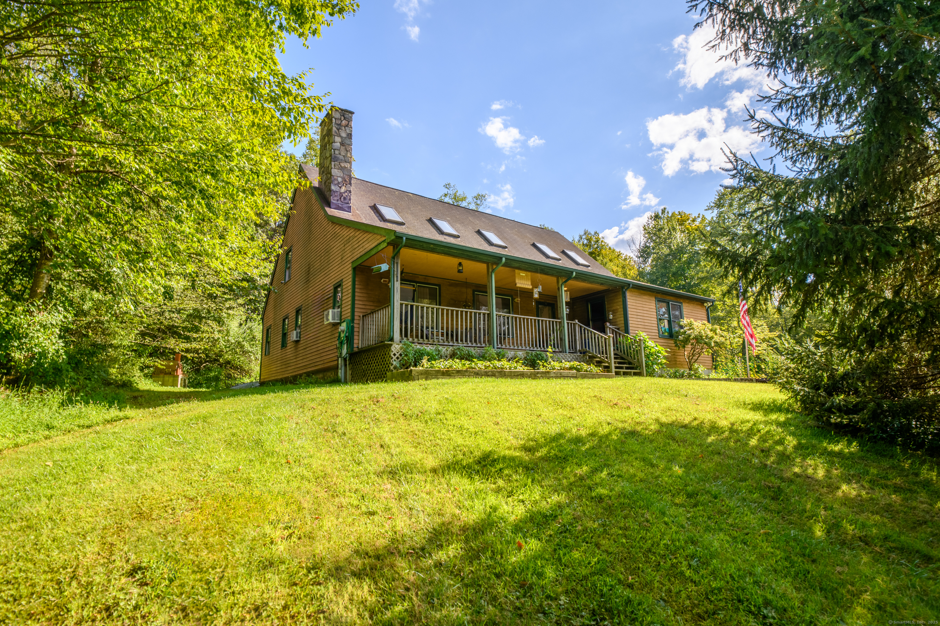 55 Mallory Road Roxbury, CT 06783 - Photo 8 of 34 a front view of a house with a yard