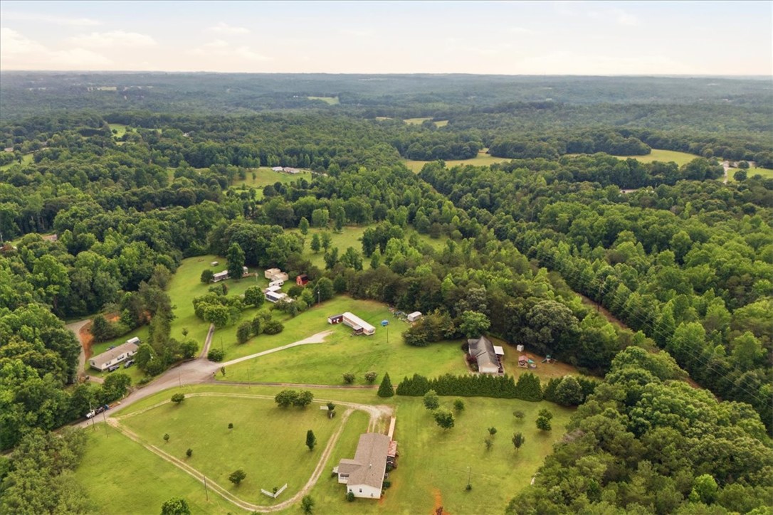 520 Sharon Lane Seneca, SC 29678 - Photo 45 of 48 Vast green expanse dotted with homes, offering a serene rural lifestyle.