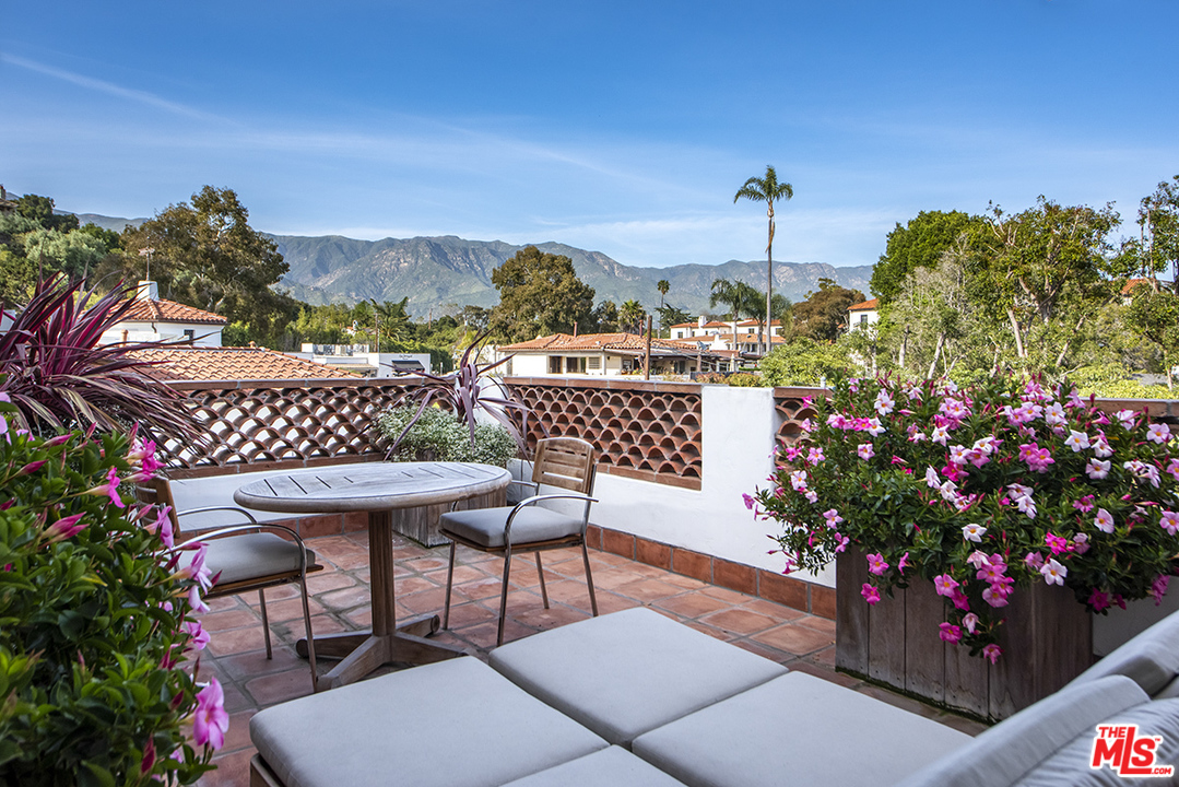 1286 Coast Village Road Montecito, CA 93108 - Photo 13 of 23 a view of a chairs and table in the patio