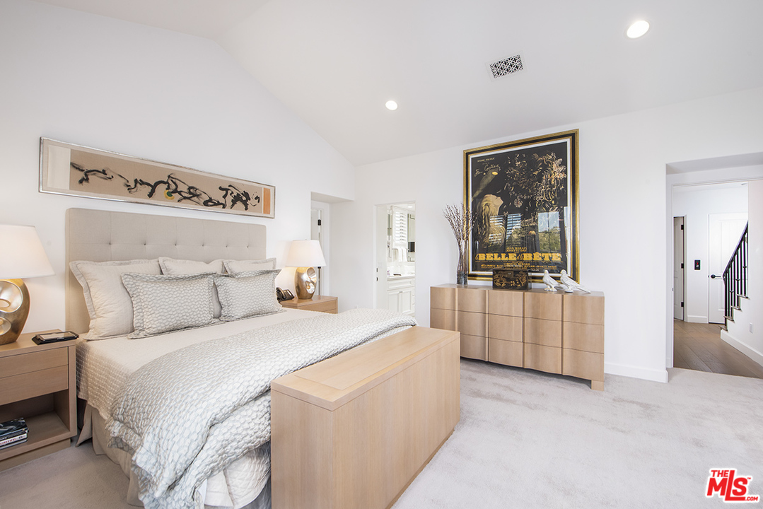 1286 Coast Village Road Montecito, CA 93108 - Photo 15 of 23 a bedroom with a bed and a refrigerator