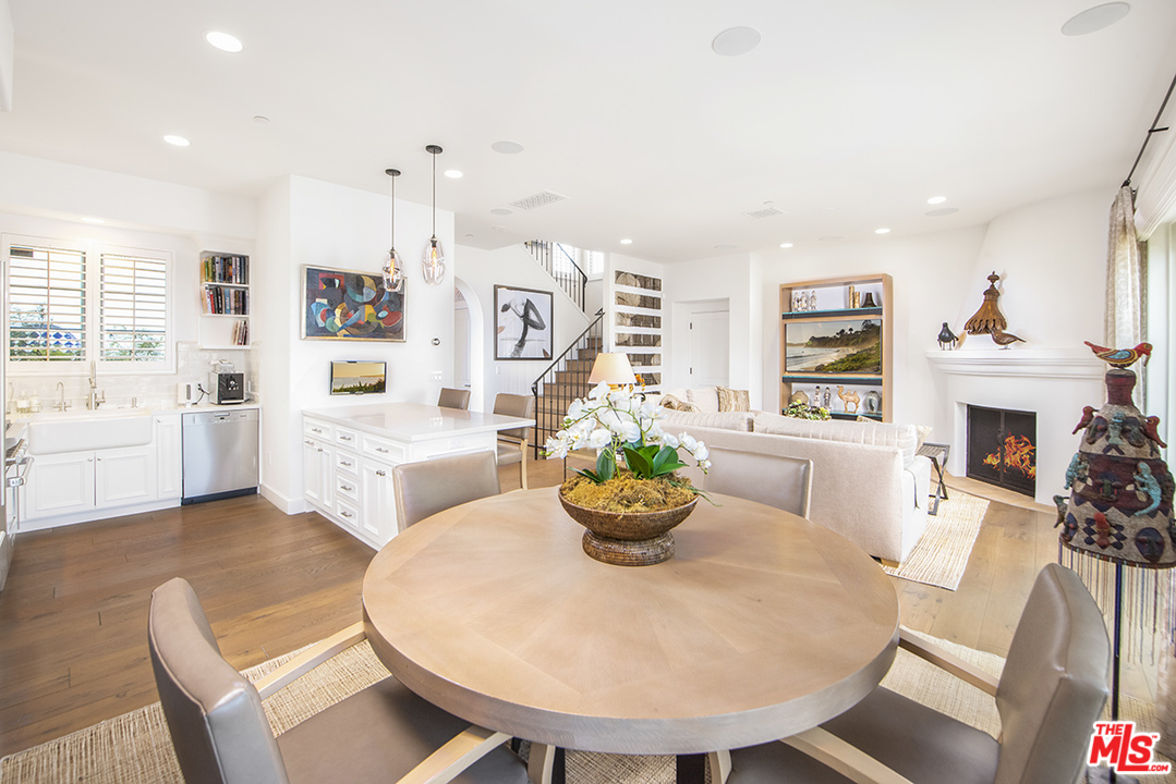 1286 Coast Village Road Montecito, CA 93108 - Photo 7 of 23 a living room with fireplace furniture and a wooden floor