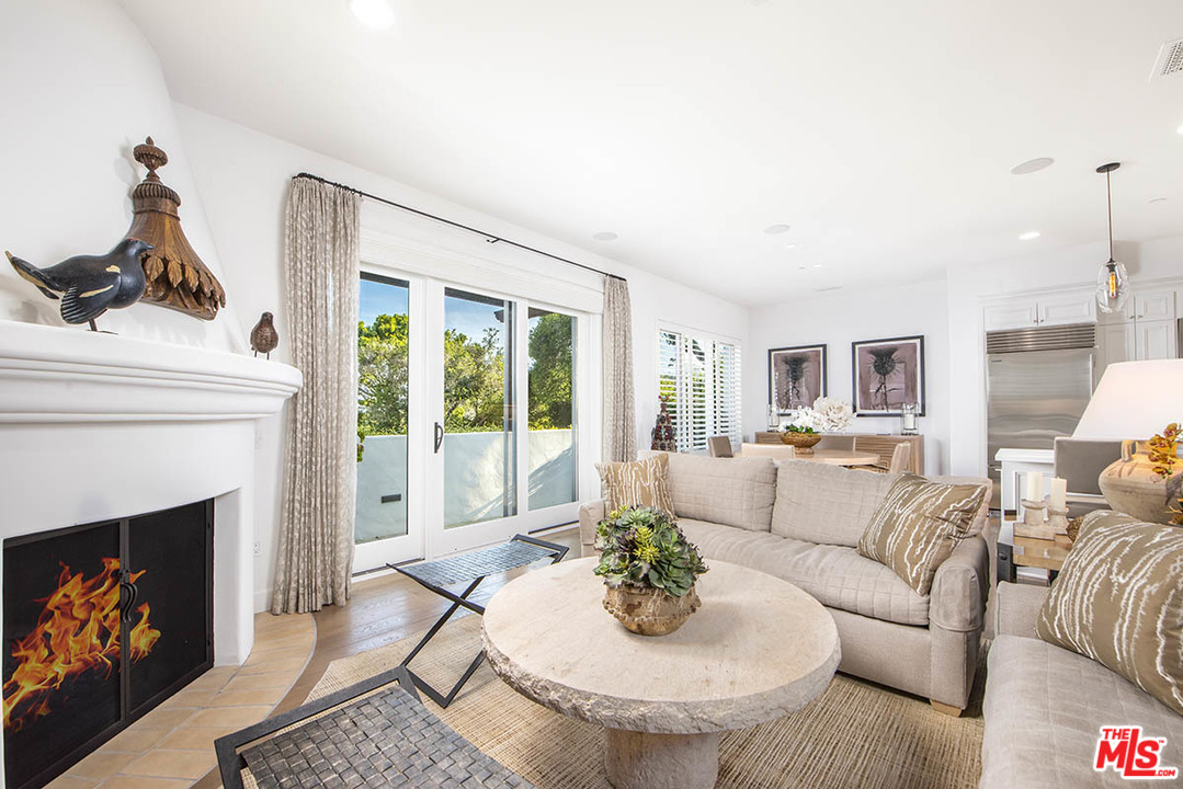 1286 Coast Village Road Montecito, CA 93108 - Photo 8 of 23 a living room with furniture and a fireplace