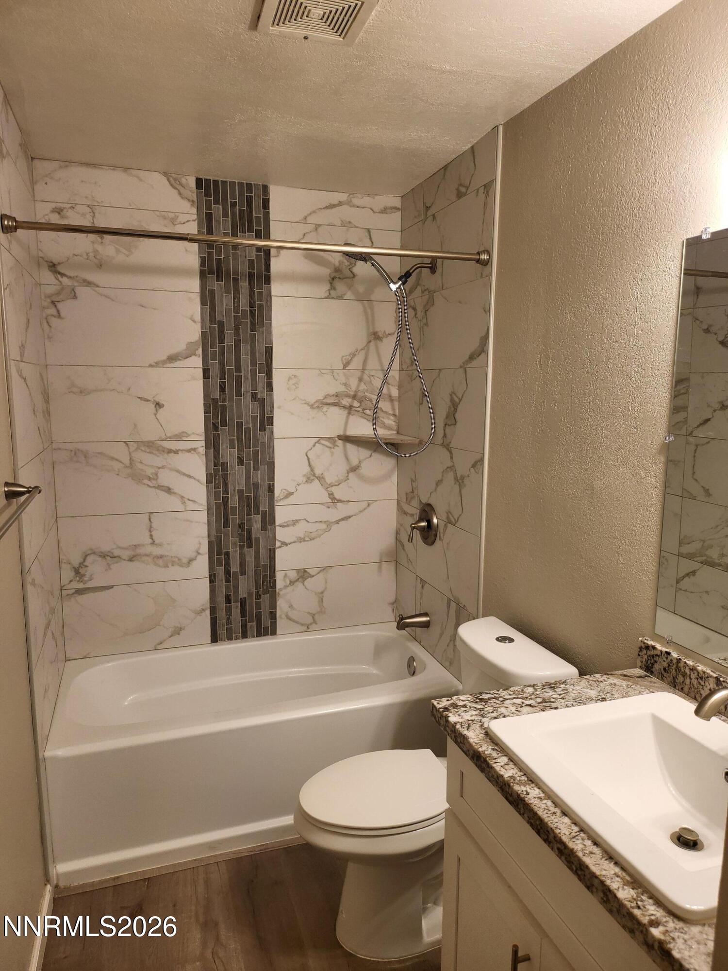 4606 Neil Road, Unit 197 Reno, NV 89502 - Photo 7 of 26 a bathroom with a sink toilet and shower