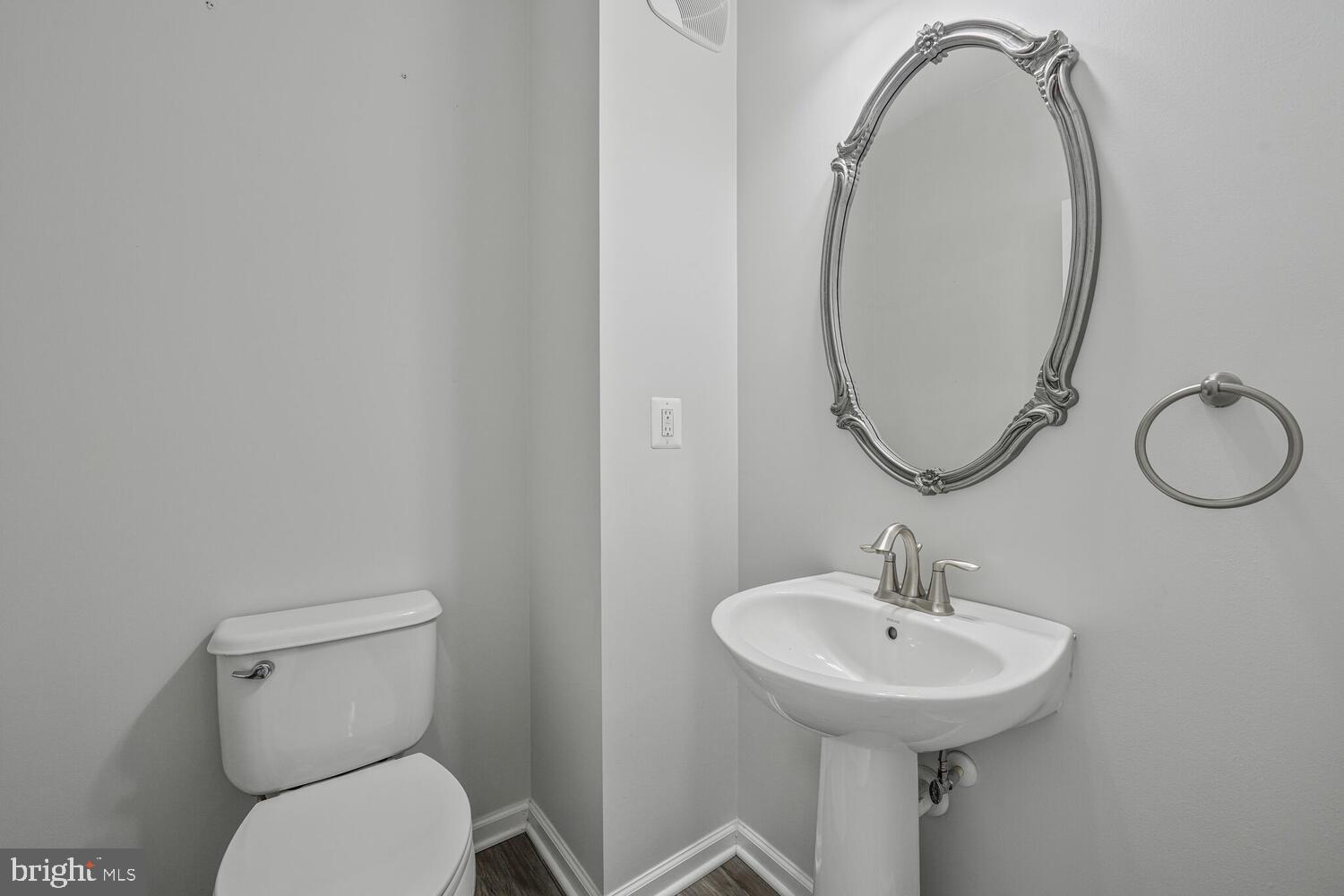 42550 Sunset Ridge Square Ashburn, VA 20148 - Photo 18 of 36 a bathroom with a toilet sink and mirror