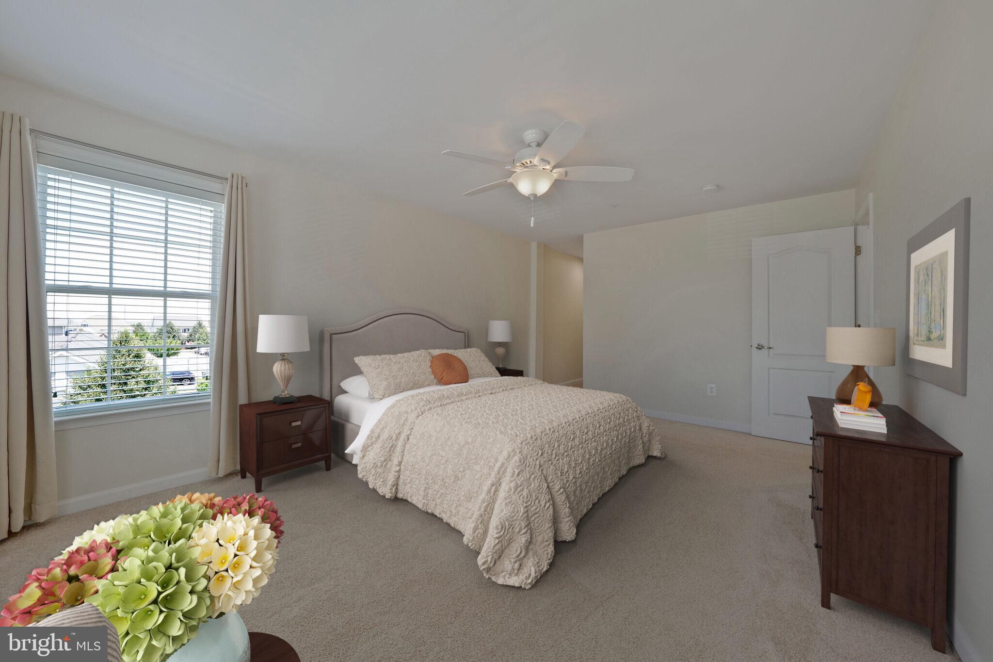 42550 Sunset Ridge Square Ashburn, VA 20148 - Photo 21 of 36 a bedroom with a bed mirror and a window