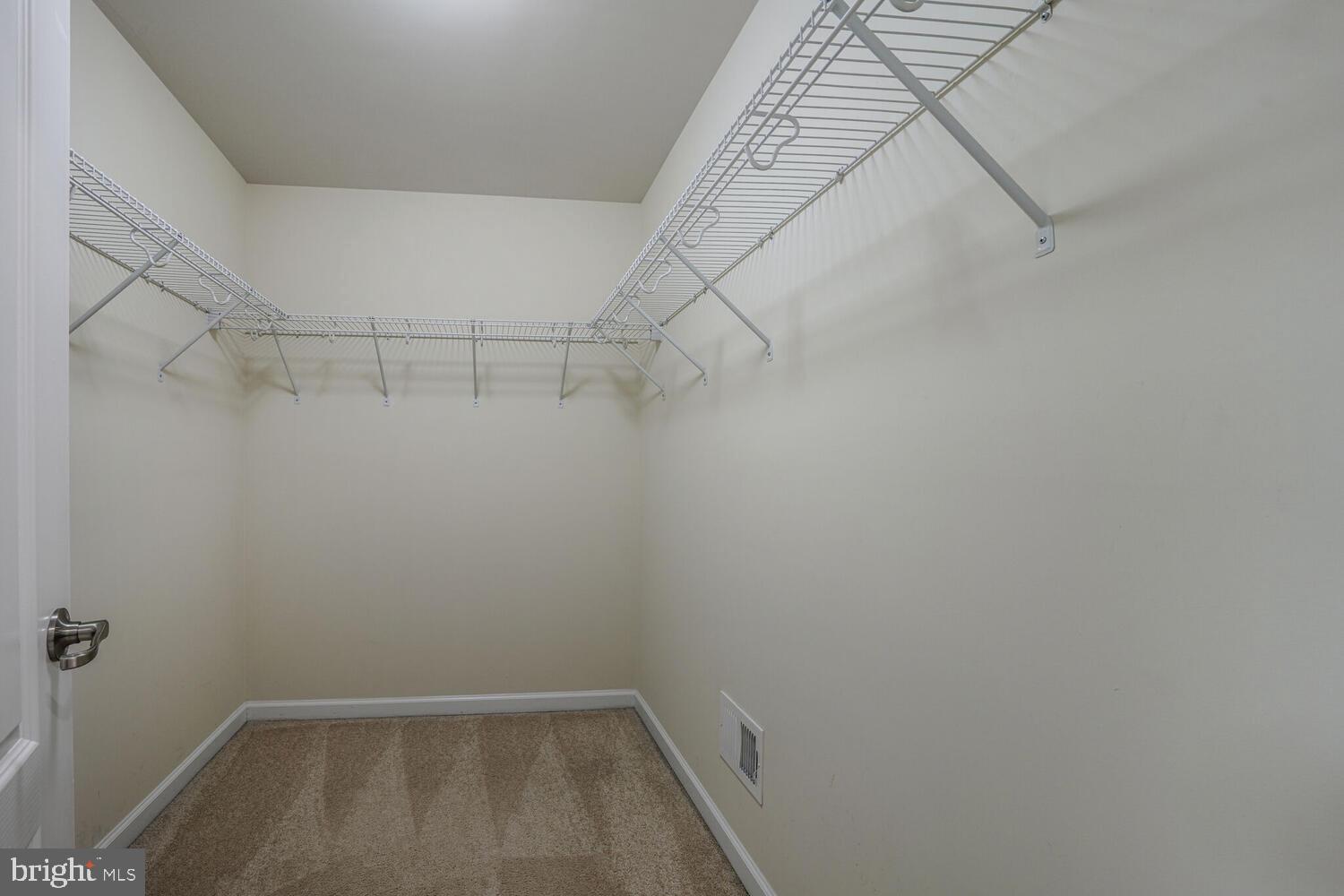 42550 Sunset Ridge Square Ashburn, VA 20148 - Photo 24 of 36 a view of a room with racks on the wall