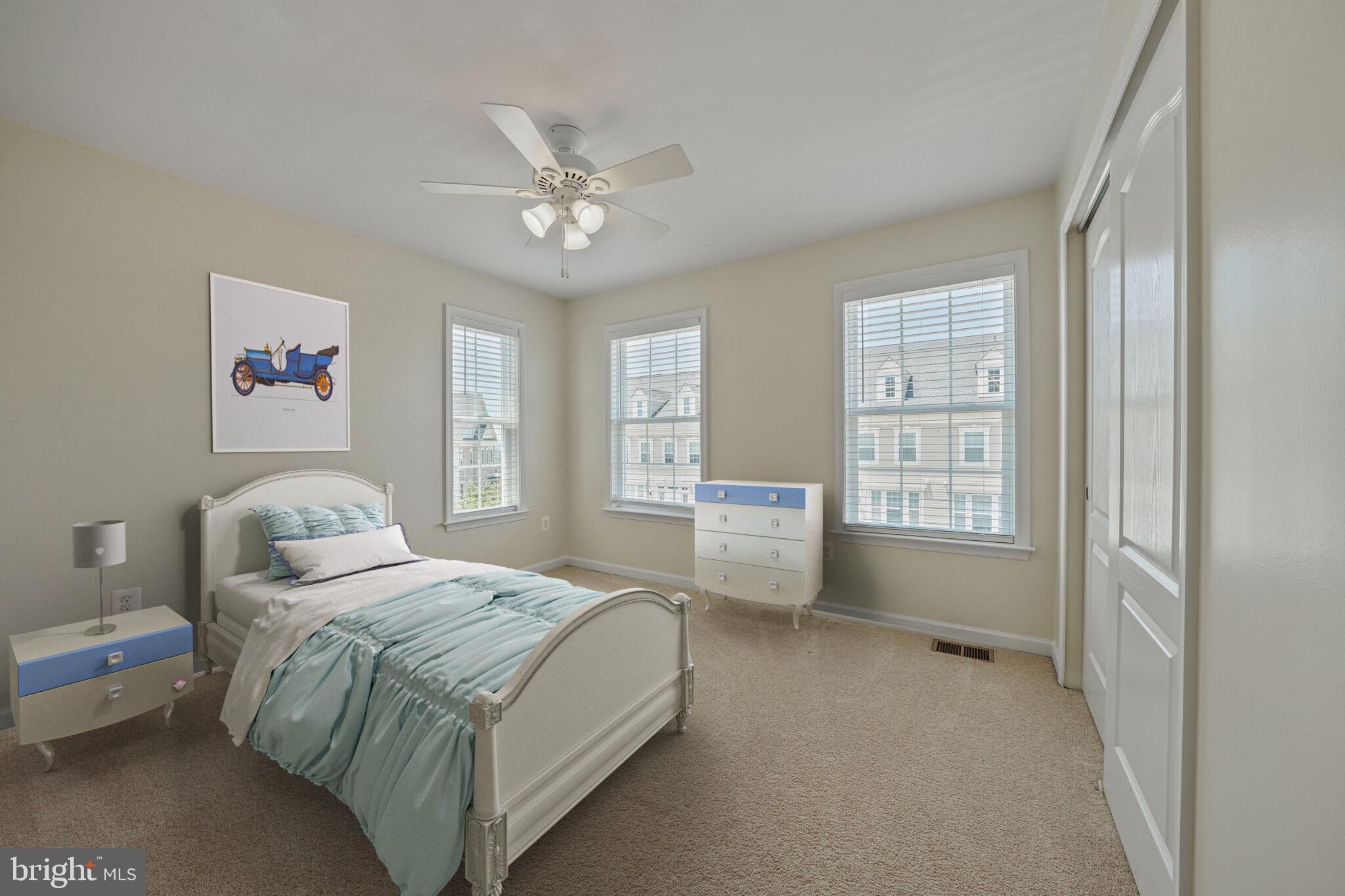 42550 Sunset Ridge Square Ashburn, VA 20148 - Photo 25 of 36 a spacious bedroom with a bed and a window