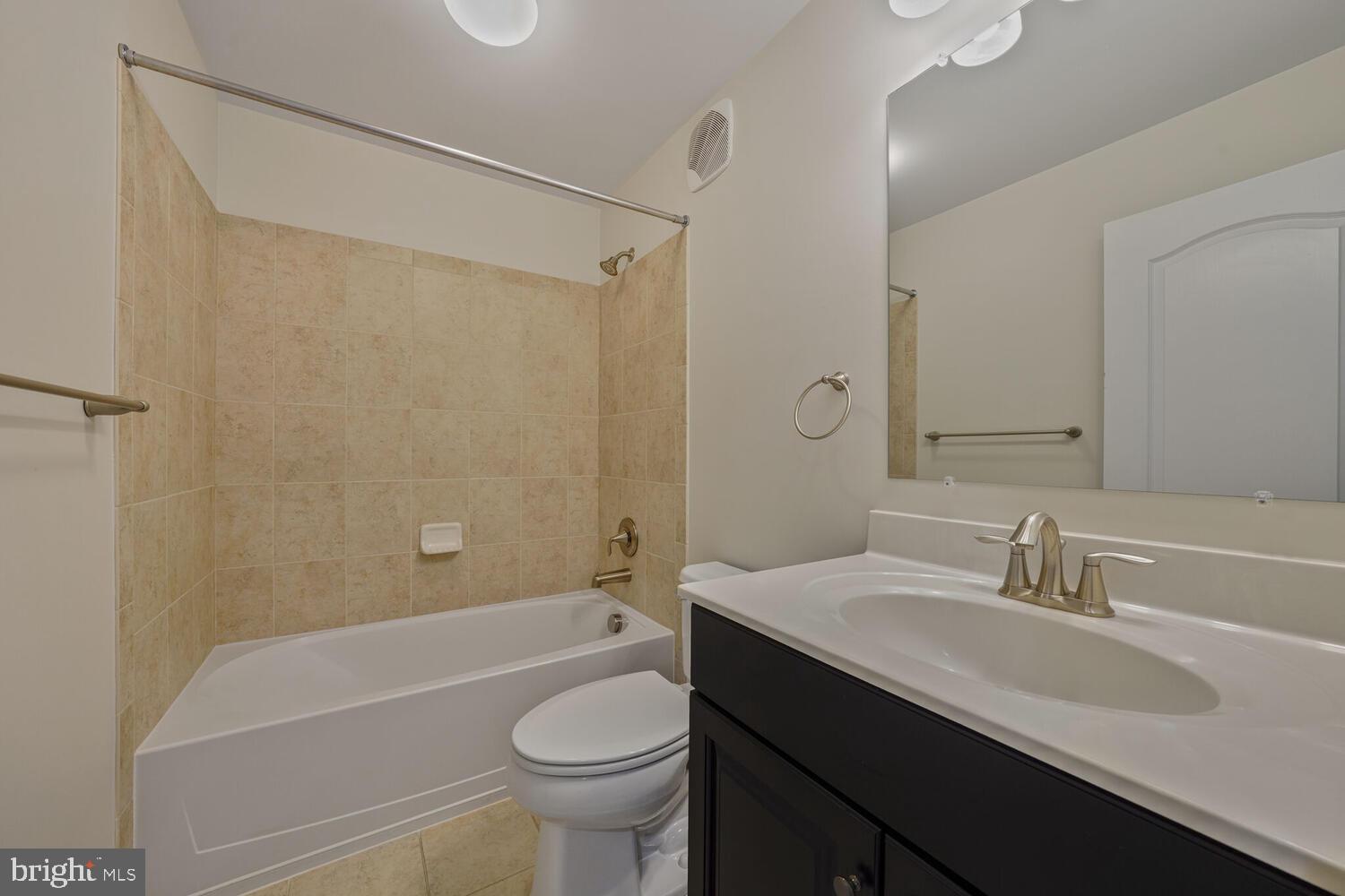 42550 Sunset Ridge Square Ashburn, VA 20148 - Photo 27 of 36 a bathroom with a sink a toilet a mirror a bathtub and shower