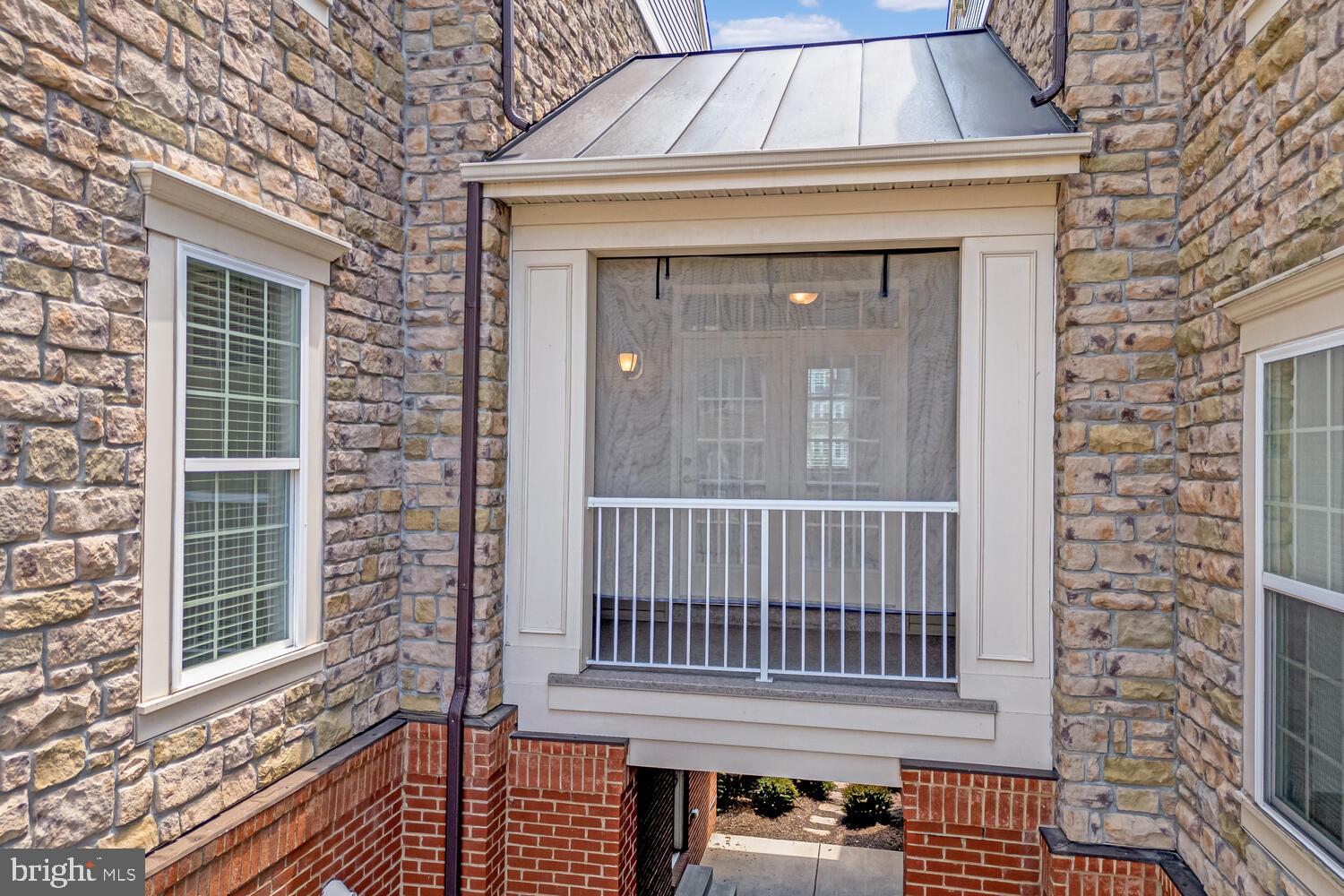 42550 Sunset Ridge Square Ashburn, VA 20148 - Photo 30 of 36 a front view of a house with a window