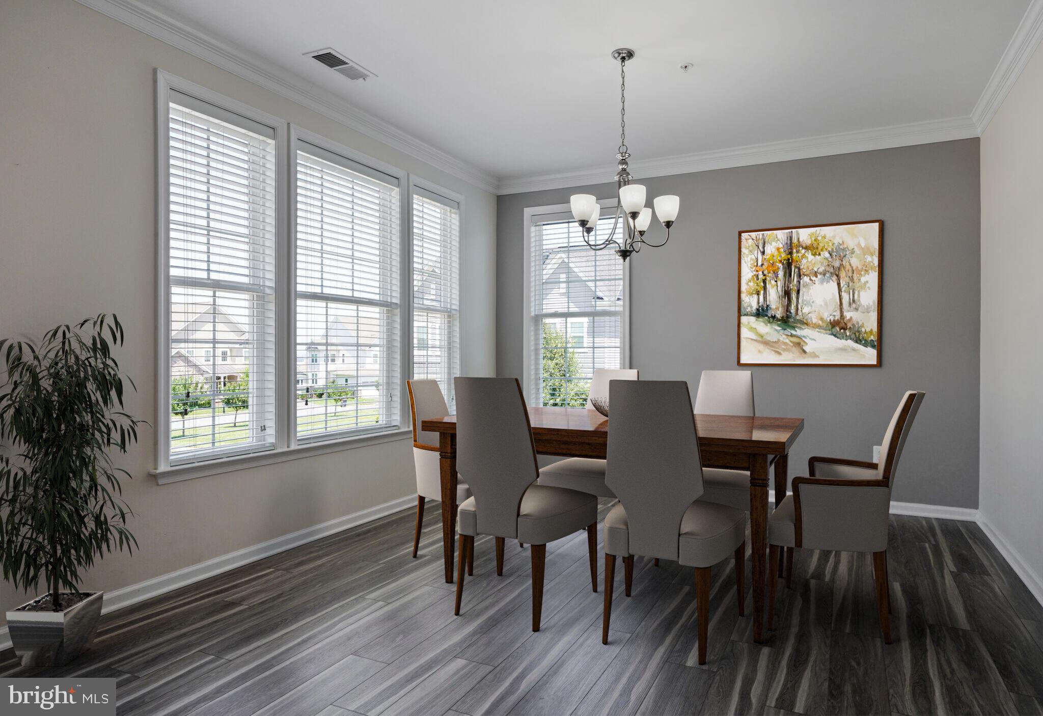 42550 Sunset Ridge Square Ashburn, VA 20148 - Photo 8 of 36 a view of a dining room with furniture window and wooden floor