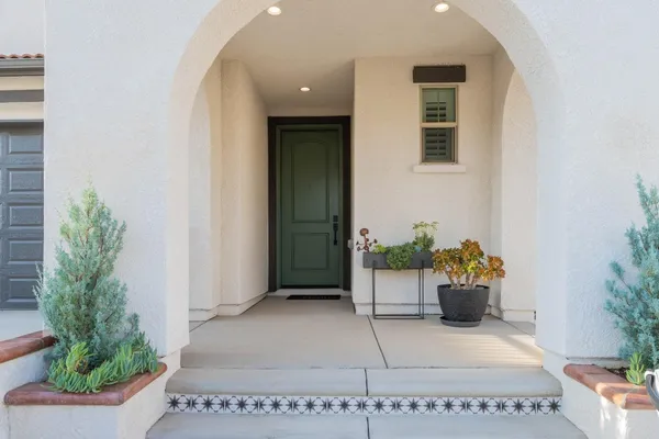 a kitchen with stainless steel appliances granite countertop a stove a sink dishwasher and cabinets with wooden floor